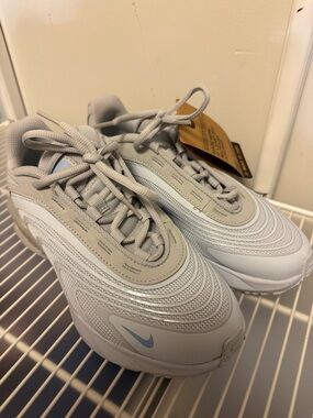 Nike Sneakers in Light Gray with Pale Blue Swoosh